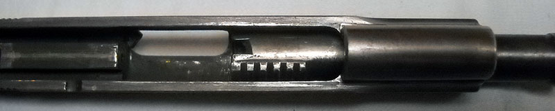detail, Colt 1903 slide with barrel partially fitted, showing relation to assembly lugs